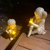Barn med Solar Fireflies hagestatuer
